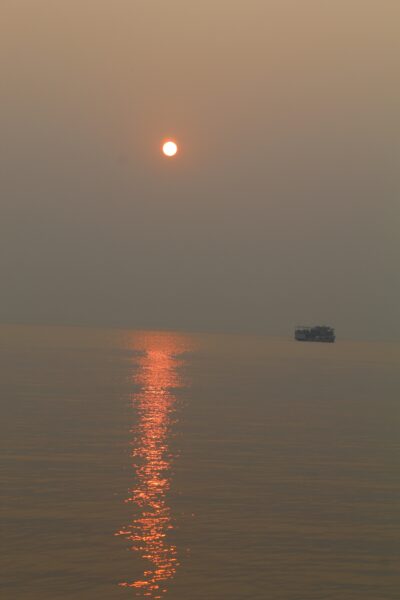 Witnessing the Majestic Red Sunset at Sea